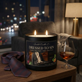 Dressed to Sin candle on a table with a necktie and cognac glass added