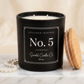 No. 5 candle with Scandal Candles Co. black and white 10 oz label on ivory marble with pearls
