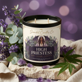 High Priestess candle styled with lavender, eucalyptus, and hemp leaves on natural stone