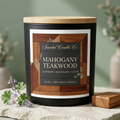 Mahogany Teakwood candle with wooden lid and full white-bordered woodgrain label beside lavender and geranium.