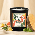 Citrus & Sage candle with bordered spiral label styled with citrus and fresh herbs