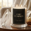 Chic Pumpkin black and gold label candle in a cozy autumn living room