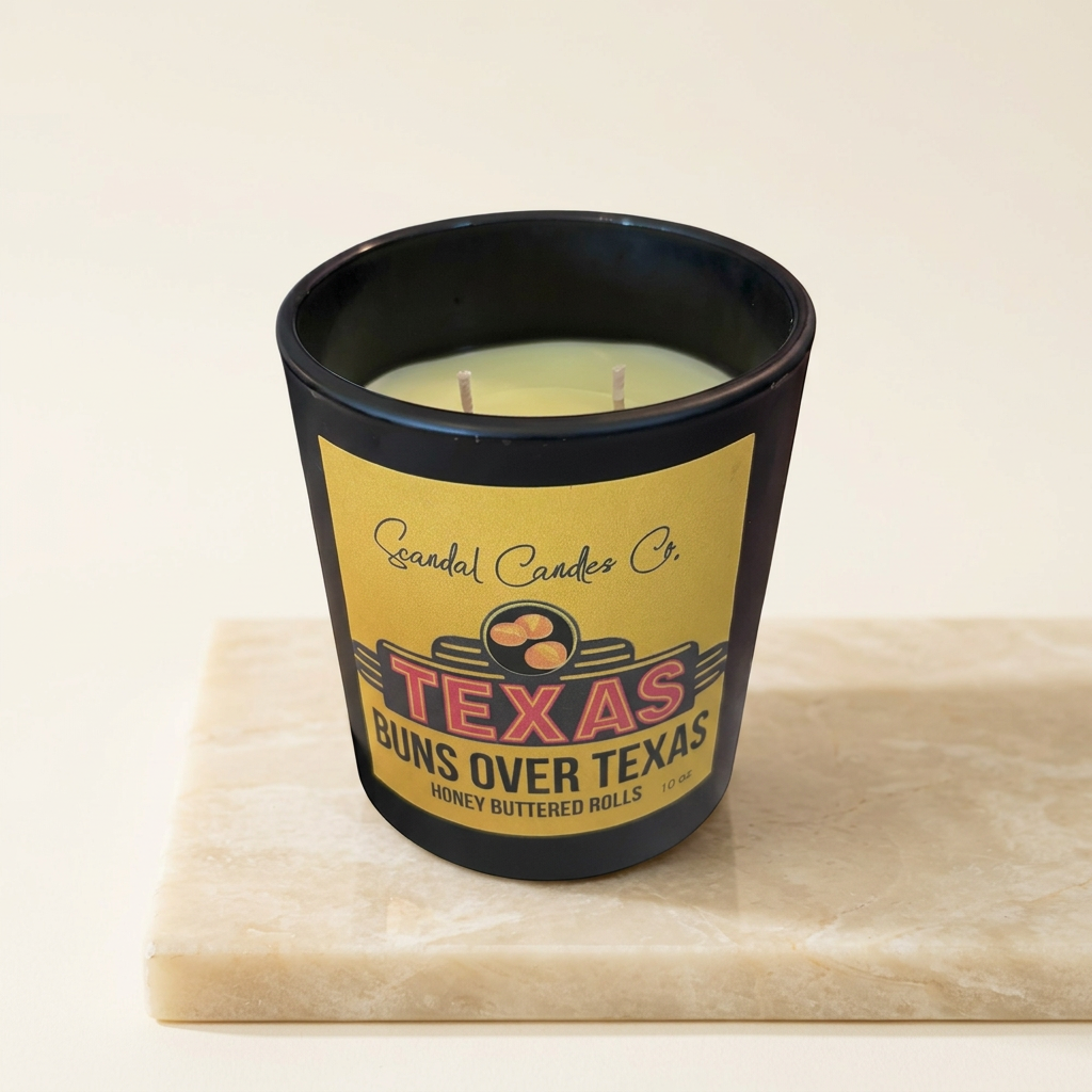 Buns Over Texas candle on a warm ivory studio background