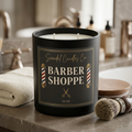 Barber Shoppe candle styled on a grooming vanity with shaving brush and towel
