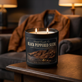 Black Peppered Suede candle burning in a warm lounge