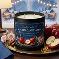 Winter Candy Apple candle styled with red apples orange zest cinnamon and winter rose, no lid