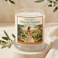 Olivia in Tuscany candle with illustrated olive grove label in an ivory studio