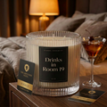 Drinks in Room 19 three-wick candle with black label in a luxury hotel room